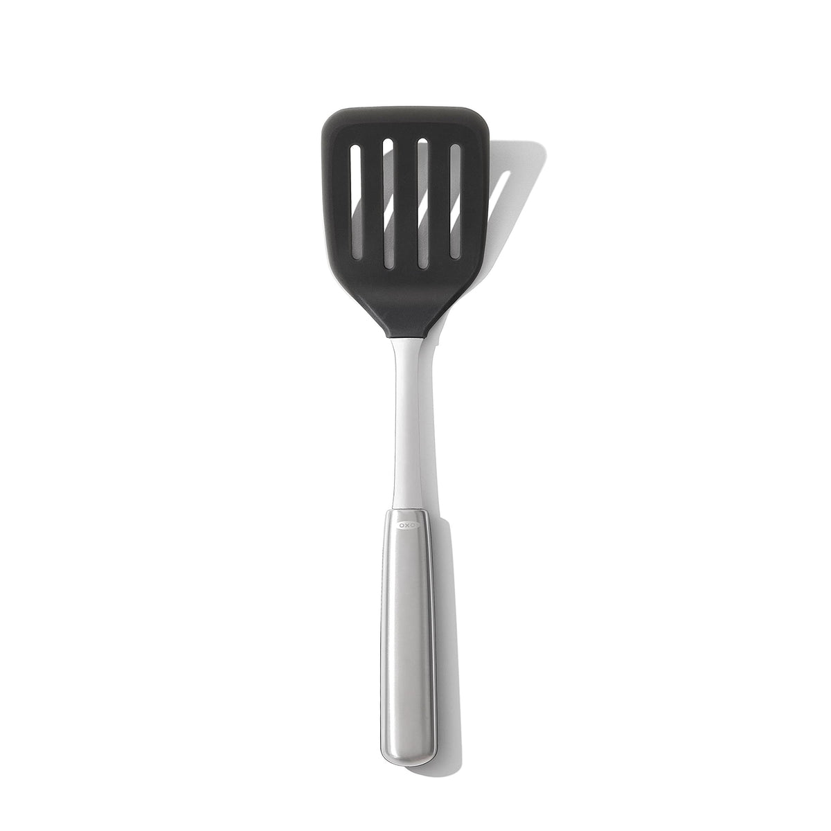 OXO Steel Silicone Flexible Turner head close-up shows heat-safe silicone for non-stick cookware