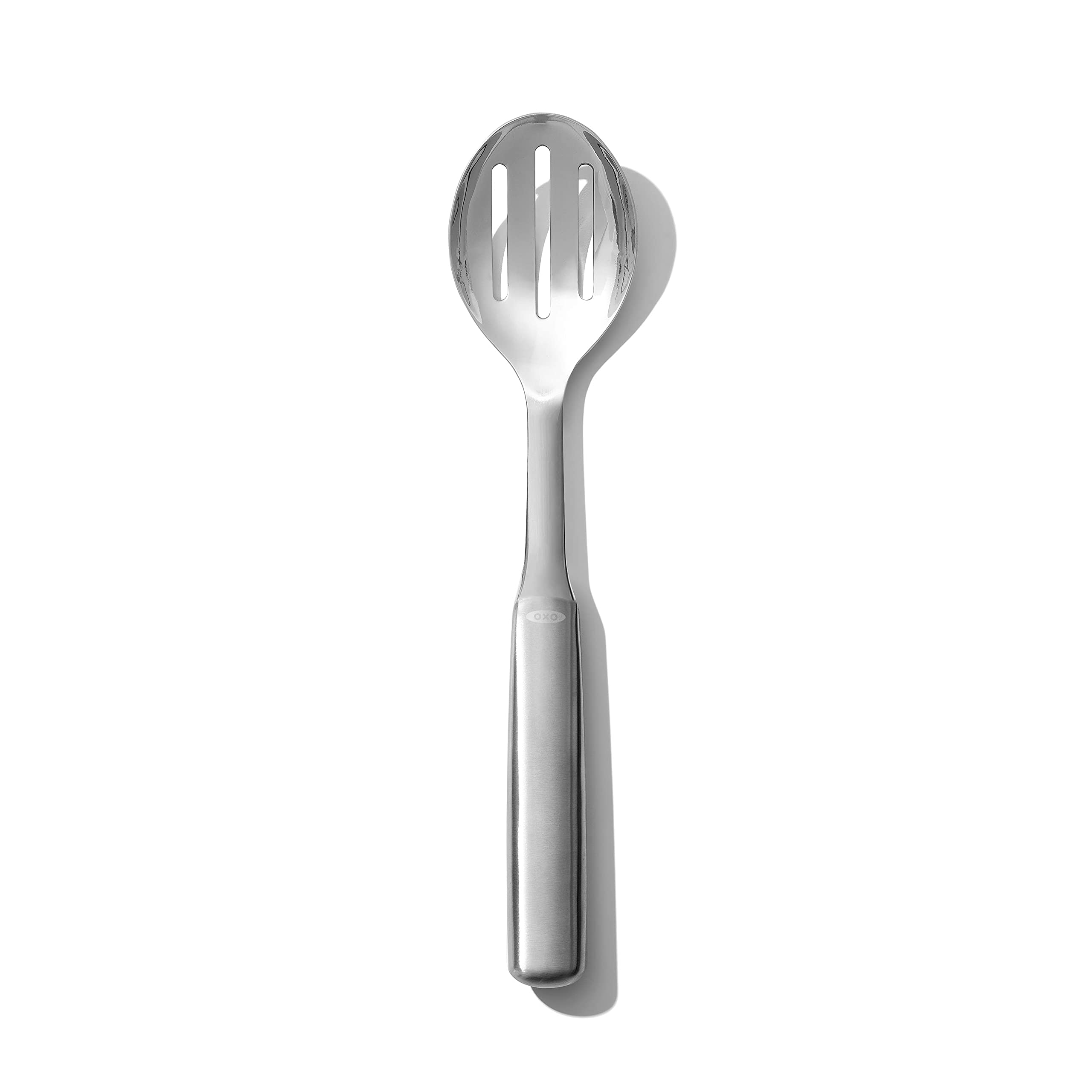 OXO steel slotted serving spoon front view, ideal for stirring and draining soups