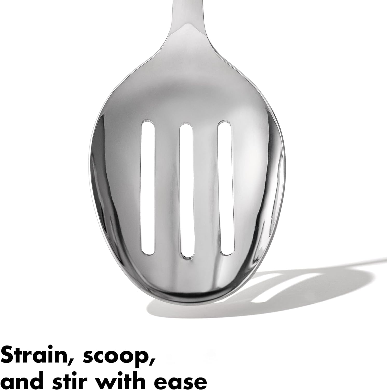 OXO Steel Slotted Spoon closeup durable tool for soups and stews.