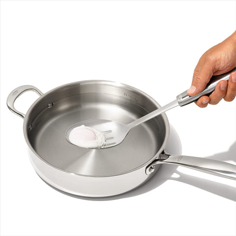 OXO Steel Slotted Spoon in pot ideal for scooping and straining sauces.