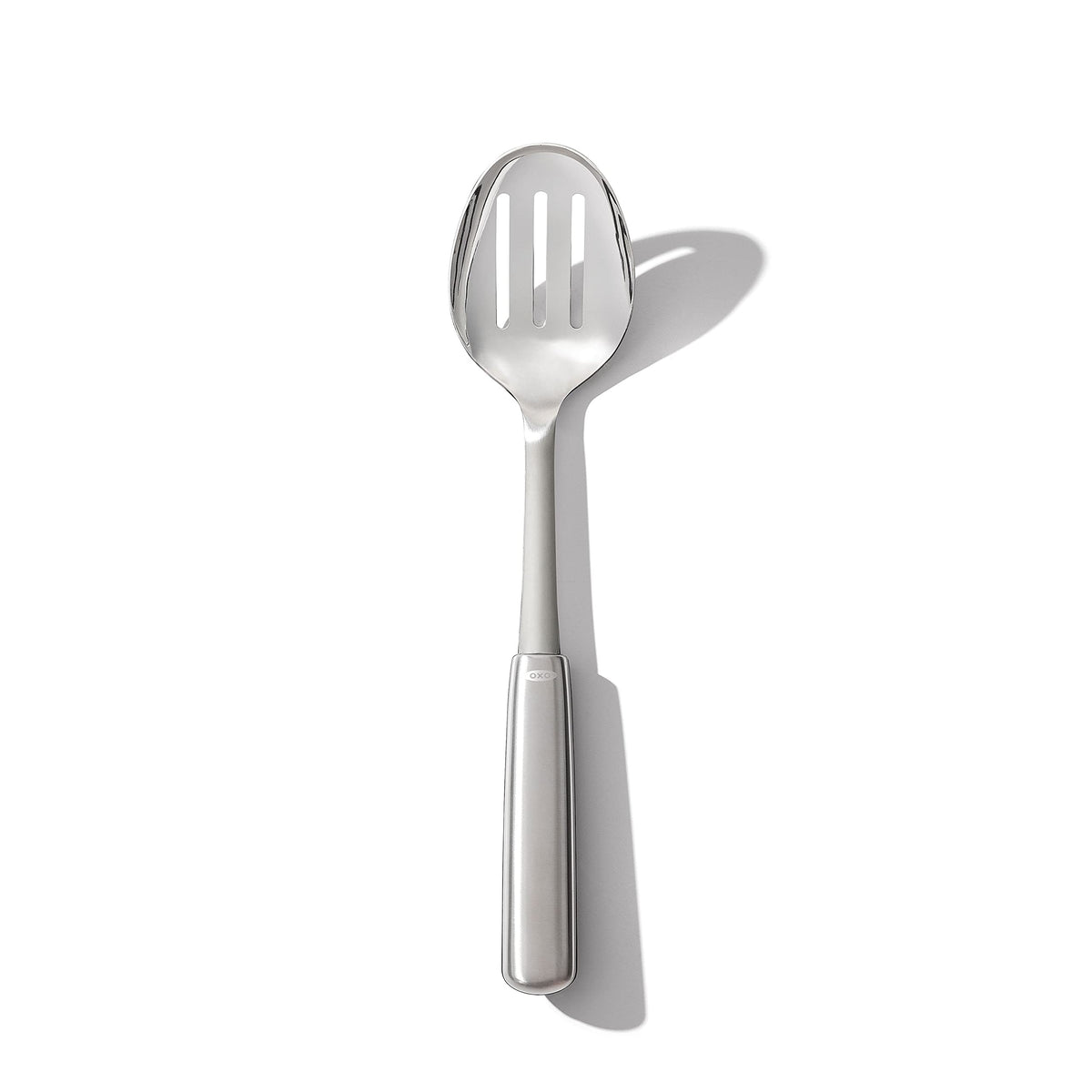 OXO Steel Slotted Spoon top view drains liquids while lifting vegetables.