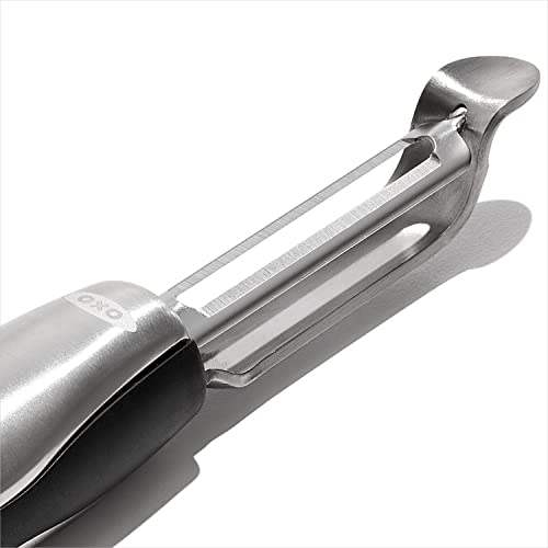 OXO Steel Swivel Peeler built in potato eye remover in action