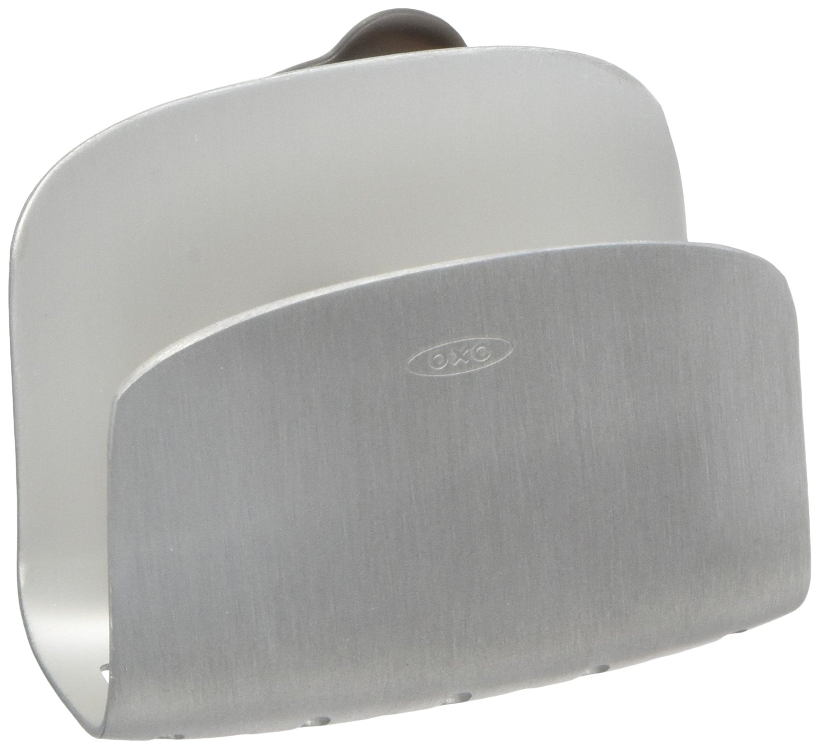 OXO suction sponge holder mounted on sink wall for secure storage.