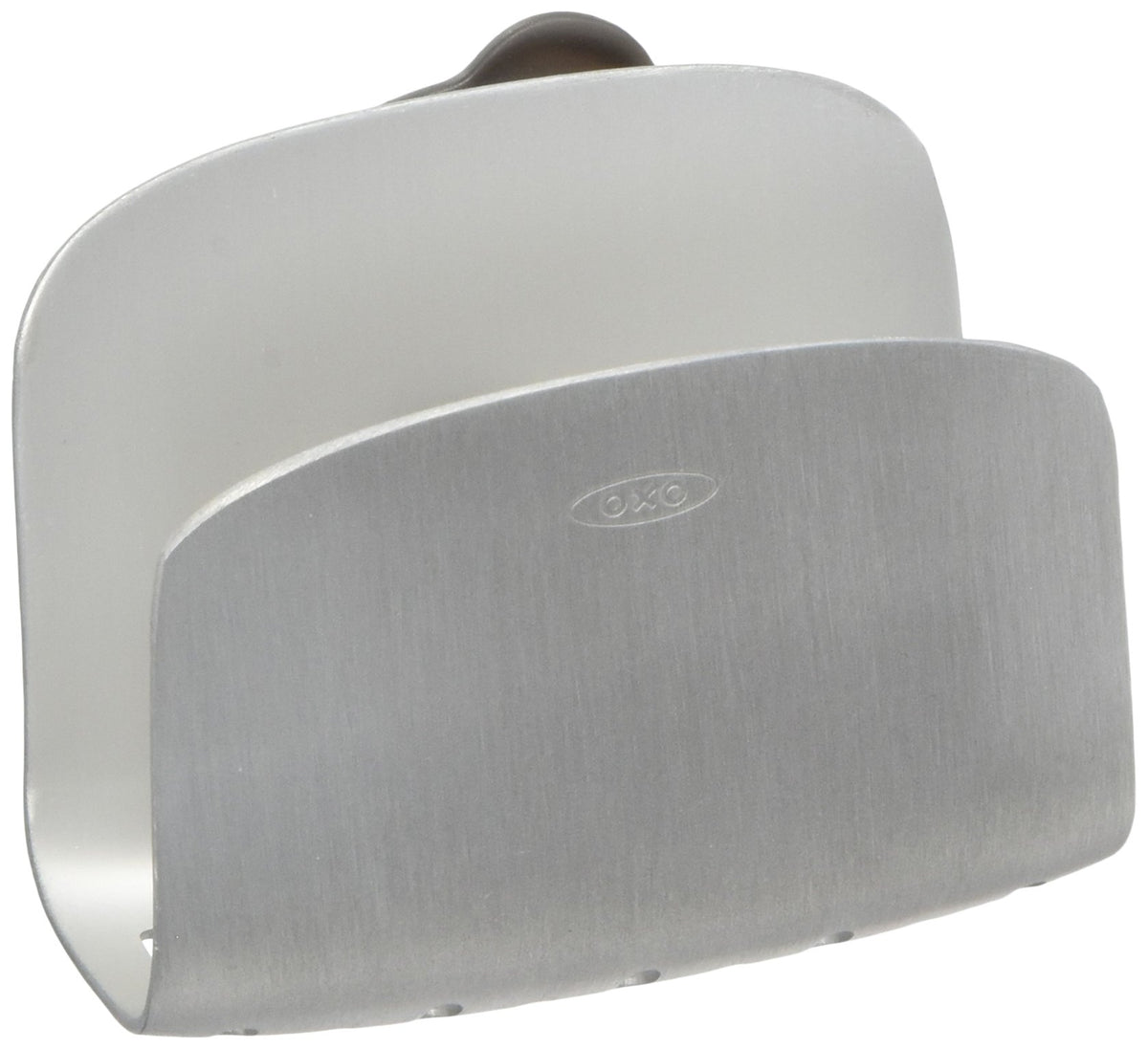 OXO suction sponge holder mounted on sink wall for secure storage.