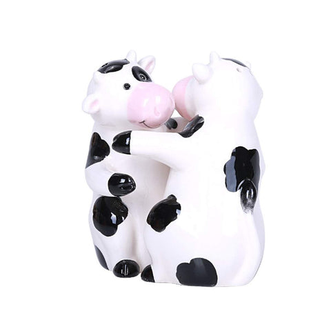 Pacific Giftware Hugging Cows salt and pepper shakers brighten meals.