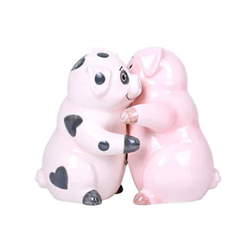 Pacific Giftware Hugging Pigs salt and pepper shakers on table, decorative and functional.