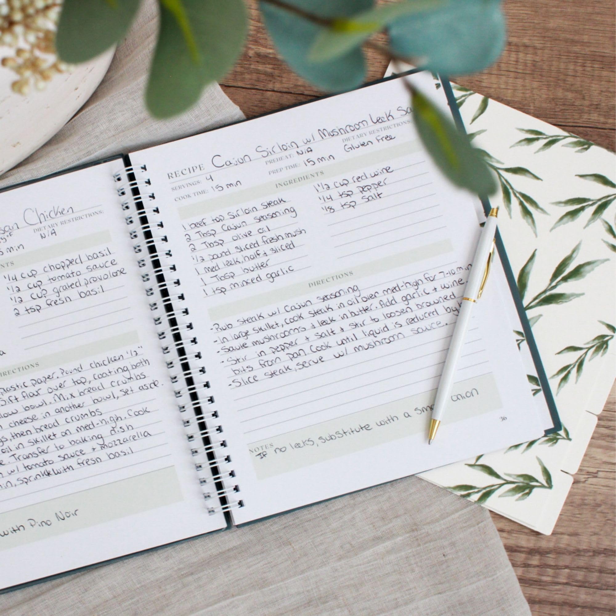 Paige McRae Recipe Book open pages showing blank templates for family recipes.