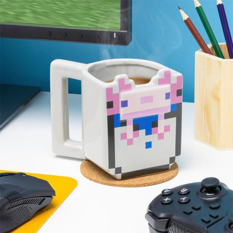Paladone axolotl mug on a gamer desk, ready for long sessions.