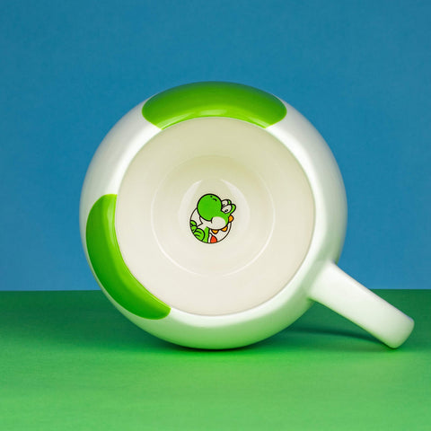 Paladone Yoshi Egg mug in use, boosting coffee breaks for Nintendo fans.