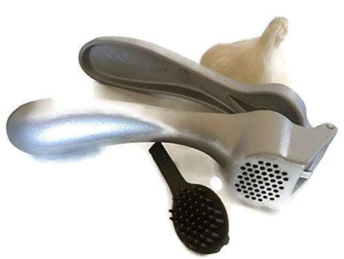 Pampered Chef garlic press 2575 with hopper open for quick garlic and ginger prep.