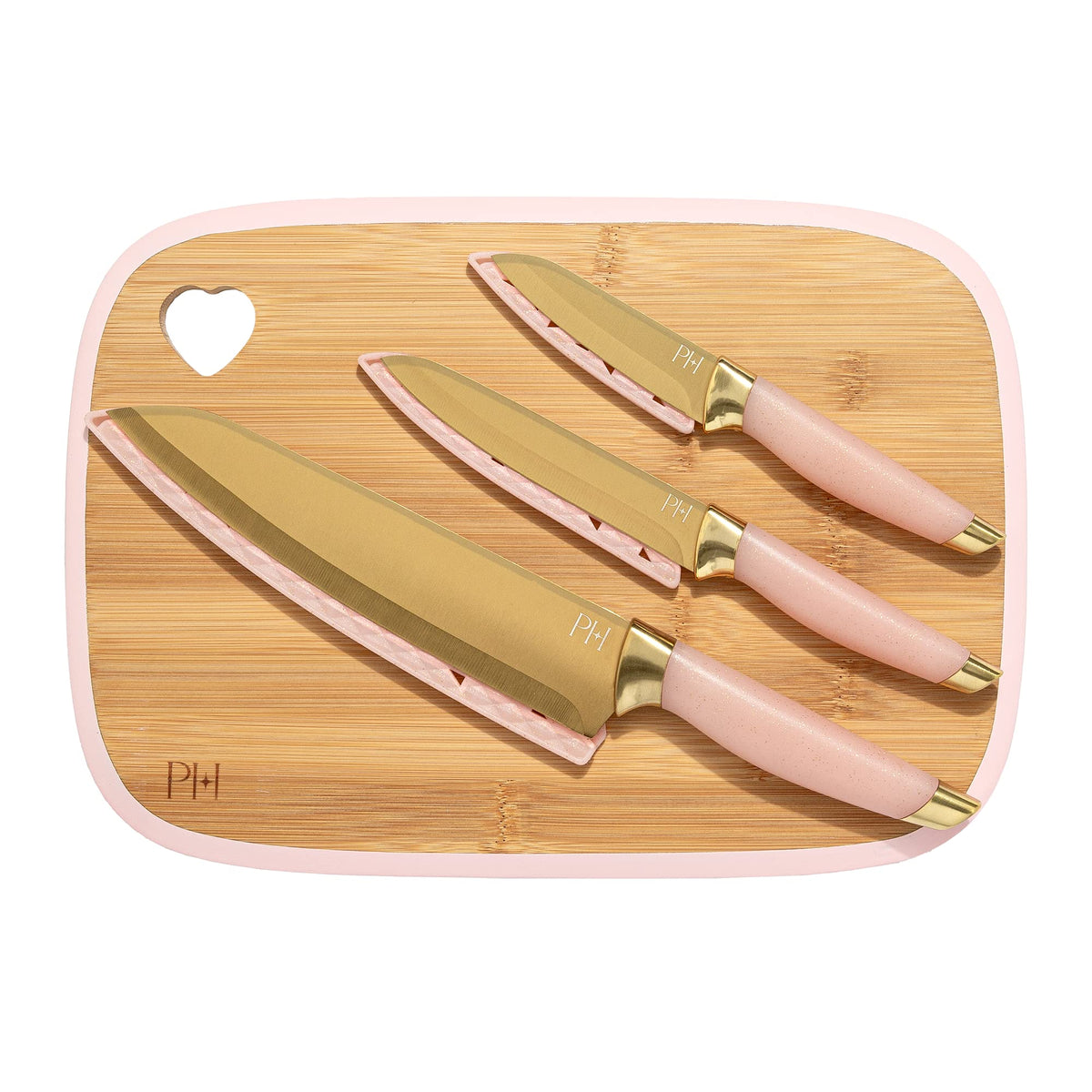 Paris Hilton bamboo cutting board with heart cutout for hanging storage.