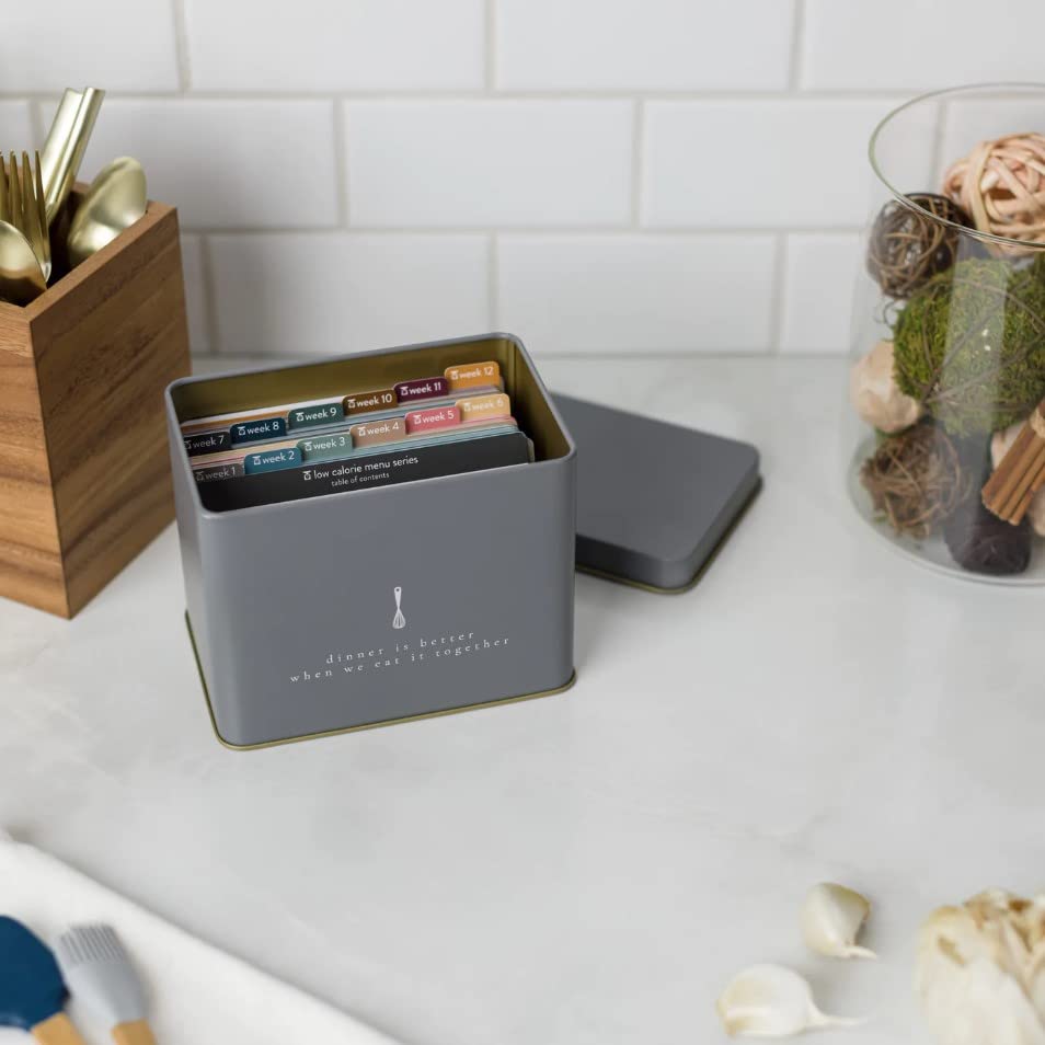 Decorative recipe box enhances countertop aesthetics.