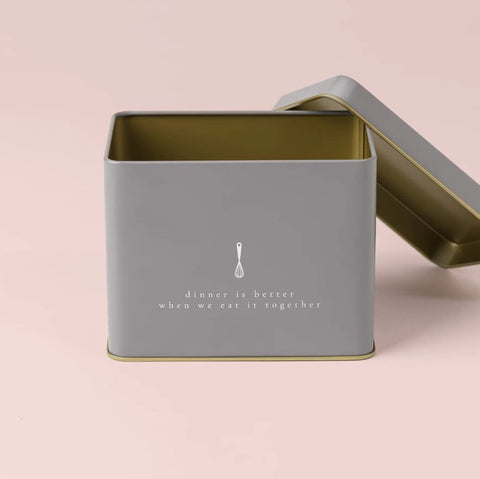 Grey tin interior gleams gold for elegant kitchen organization.