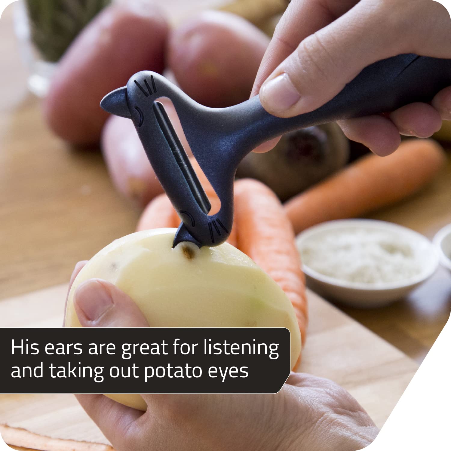 Peleg Design CatPeeler in-hand use shows comfortable grip for peeled potatoes and carrots.
