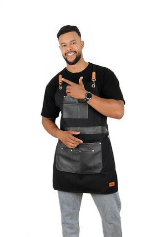 Pelocapa barber apron in black helps hide stains during busy shifts