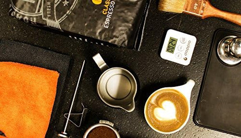 Pendoo Puly Caff Plus cleaner in use, preserving machine hygiene and performance.