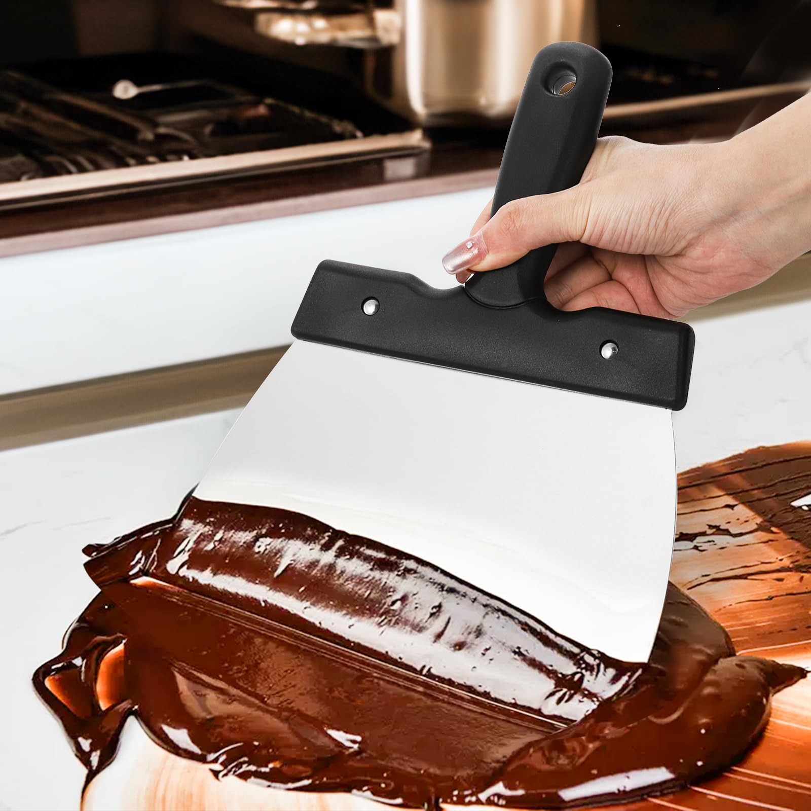 Peohud marble-tempering spatula helps smooth chocolate on slabs for an even finish.