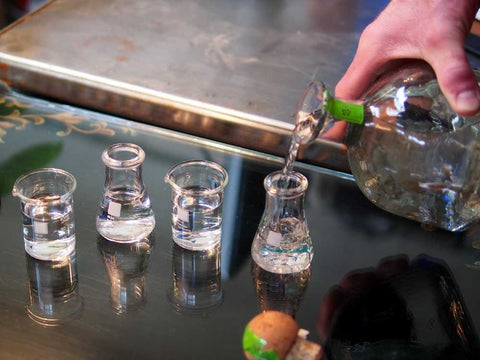 Periodic Tableware lab beaker shot glasses setup image highlights durable borosilicate glass.
