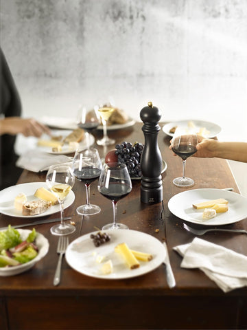 Peugeot Paris pepper mill with adjustable grind knob, demonstrating customization for precise seasoning.