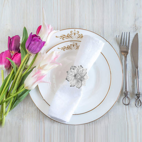 Close-up of Picowe napkin ring showing silver finish and delicate detailing.
