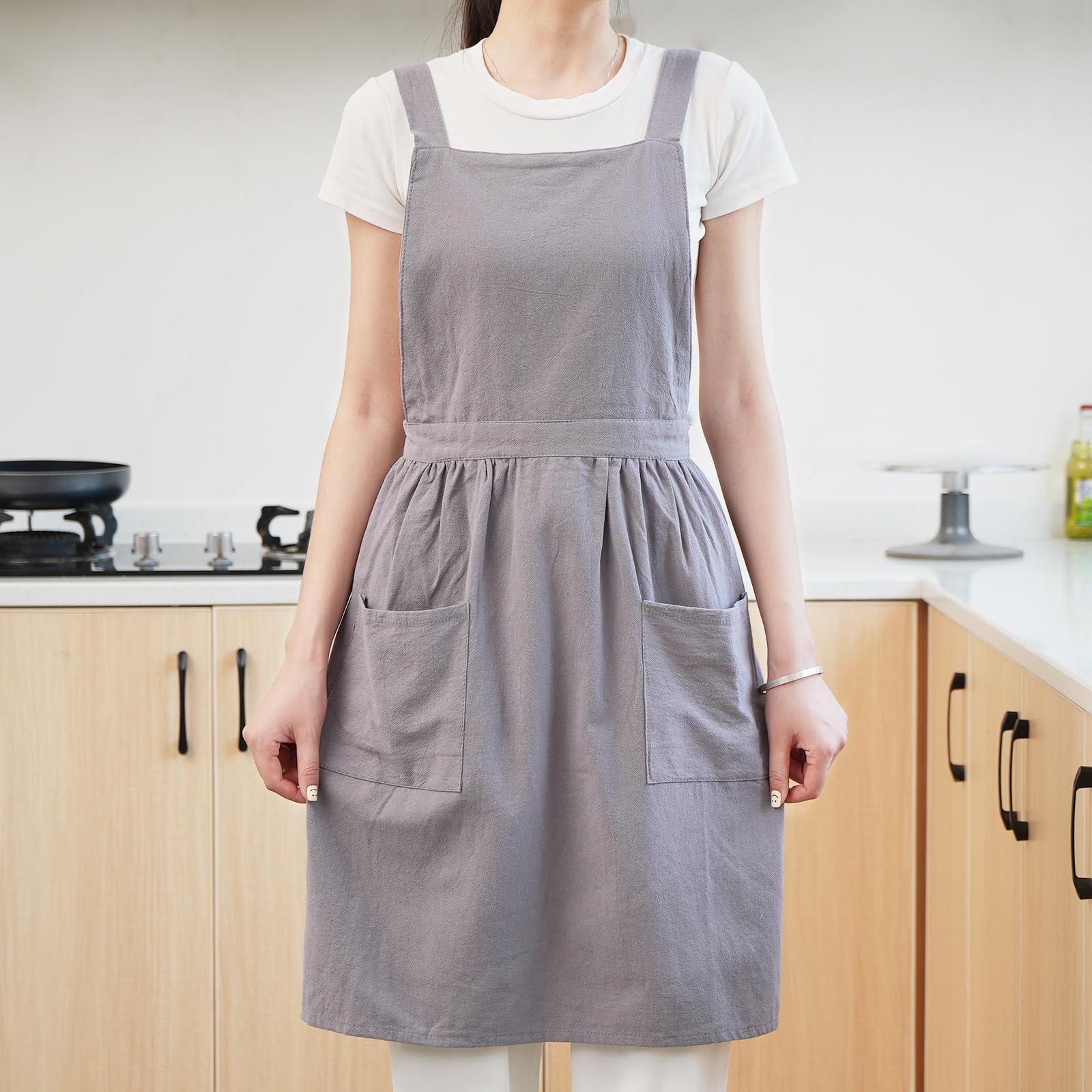 Pinknoke gray apron shown in kitchen setup for versatile cooking and baking tasks.