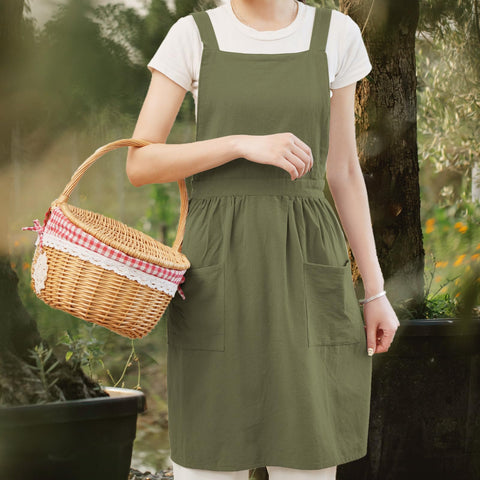 Pinknoke apron olive green with two pockets, showcasing handy storage while cooking