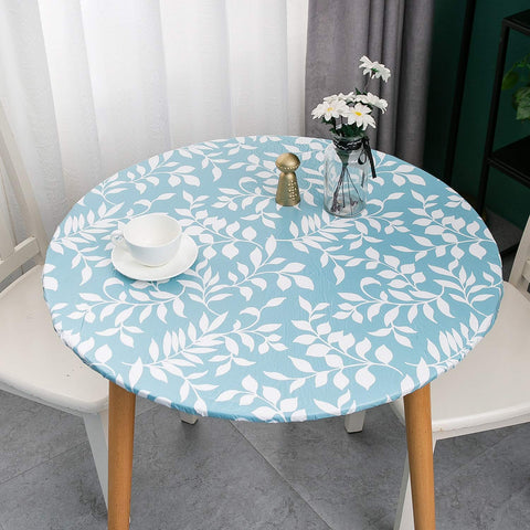 Pioggia round tablecloth with flannel backing protects surfaces softly.