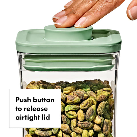 Pistachio lids on OXO Good Grips containers in a front view.