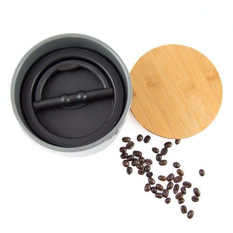 Grey ceramic canister with bamboo top for elegant kitchen storage