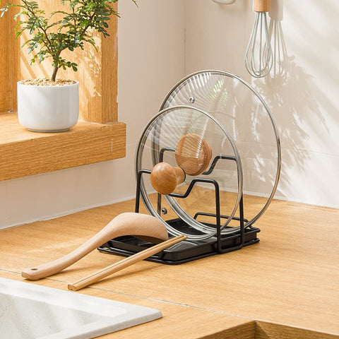 Poeland pot lid holder with drip tray catches drips for a cleaner workspace.