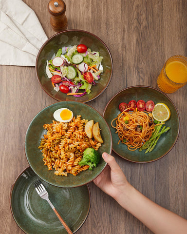 Pokini bowls arranged on a dinner table ideal for pasta, salad, or soup.