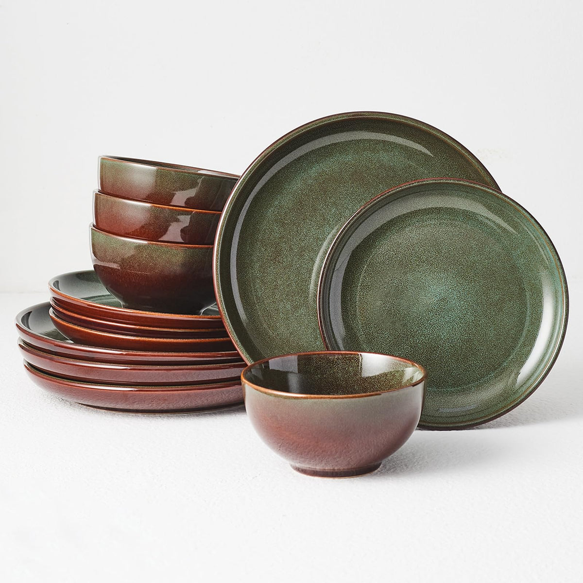 Pokini stoneware dinner set for four with reactive glaze, unique color variation.