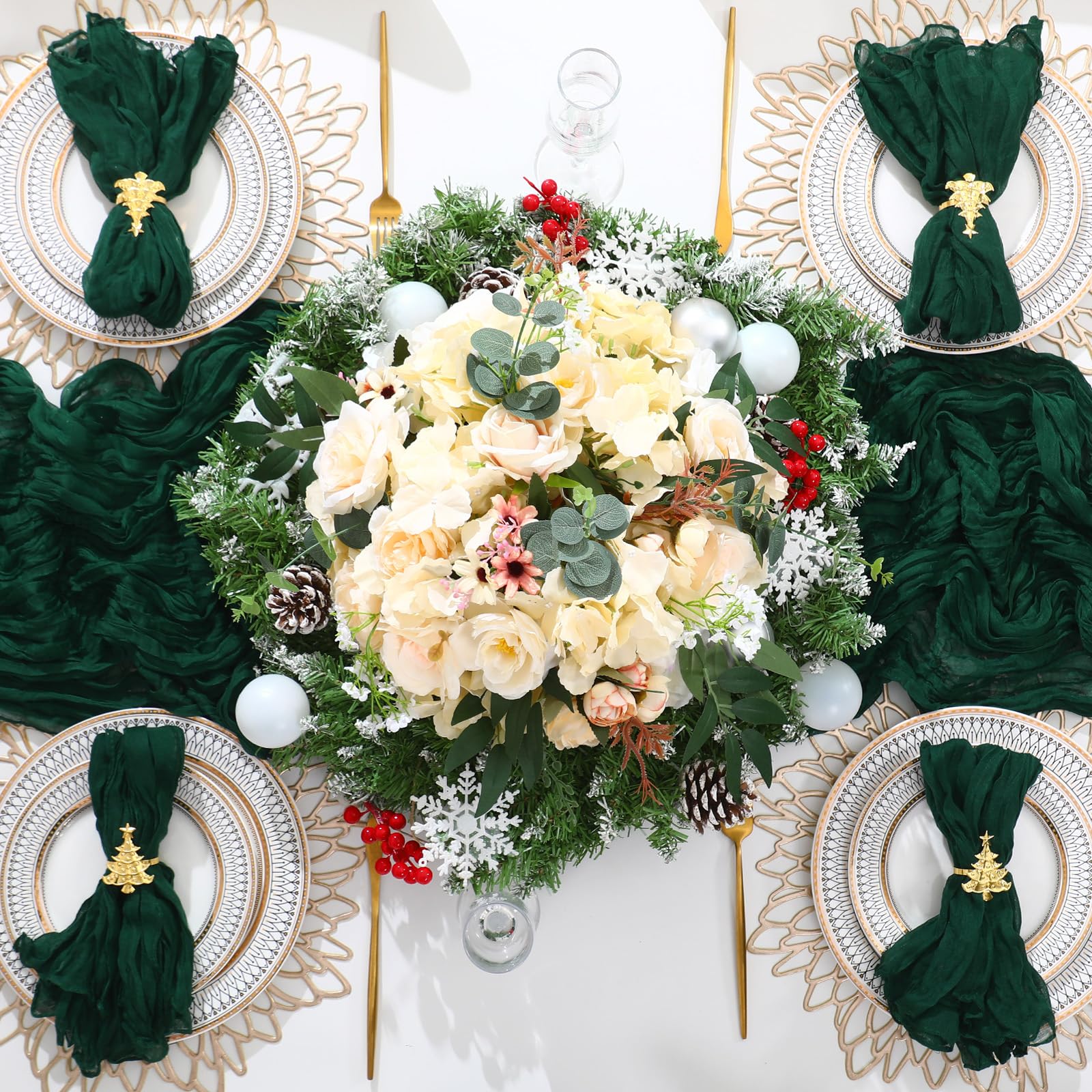Preboun festive dining setup with green runners and gold rings