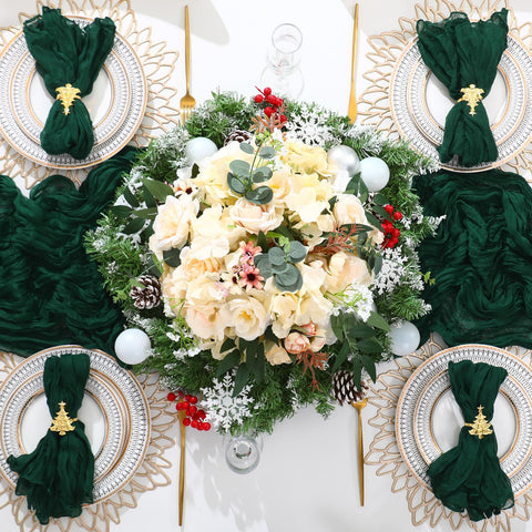 Preboun festive dining setup with green runners and gold rings