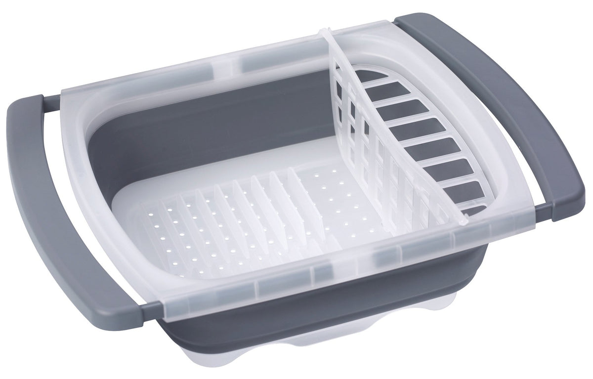 PrepWorks collapsible dish drainer over sink drying plates and bowls.