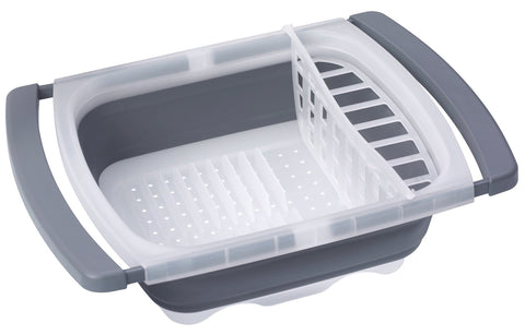 PrepWorks collapsible dish drainer over sink drying plates and bowls.