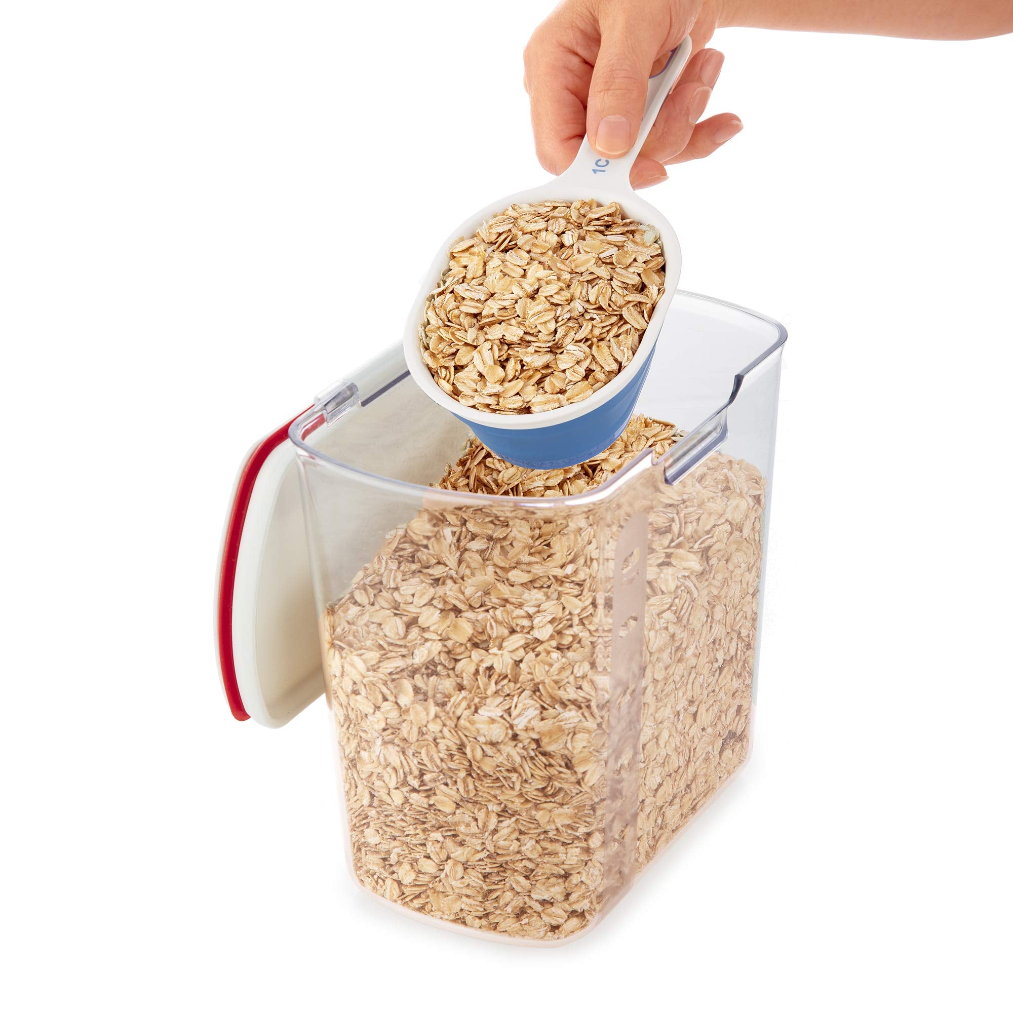 PREPWORKS collapsible cups shown scooping from a narrow container for slim spaces.