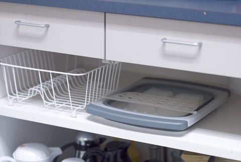 Extendable arms allow drying over sink without countertop clutter.