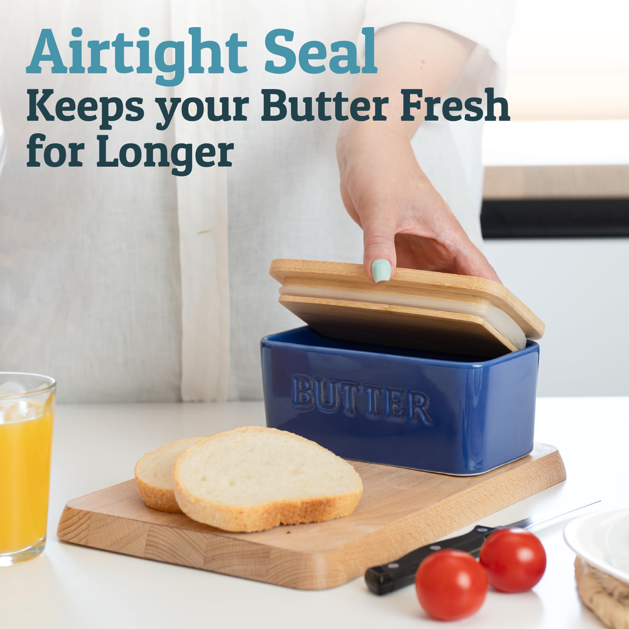 PriorityChef ceramic butter container in dark blue glaze on kitchen counter