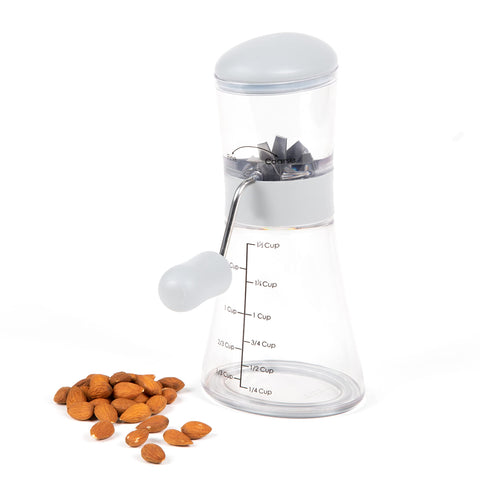 Progressive Prepworks Nut Chopper removable base for direct topping over food.