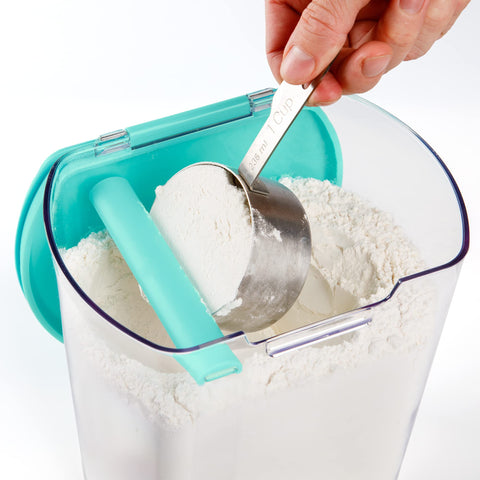 Progressive ProKeeper powdered sugar keeper with leveling bar and dusting tool for mess-free dusting.