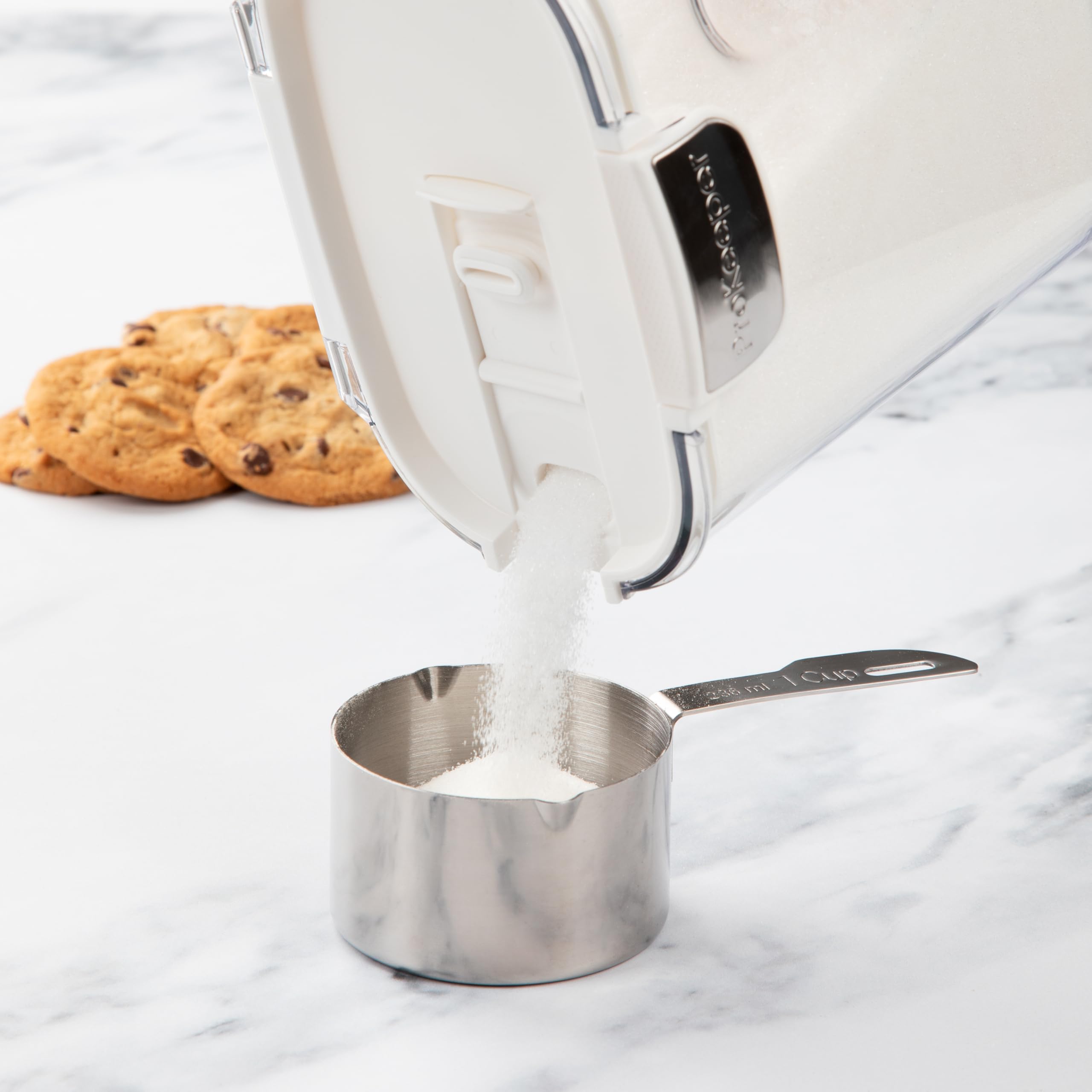 ProKeeper+ Magnetic dusting spoon pairs with Powdered Sugar Keeper for mess-free dusting.