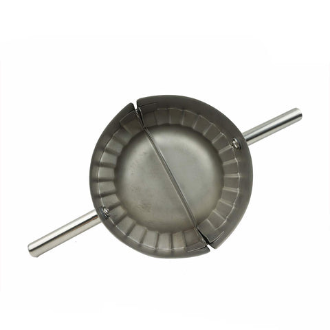 Proshopping 2-in-1 dumpling tool in action sealing wrappers.