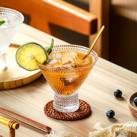 PTSTING martini glasses with tapered silhouette help keep drinks cooler.