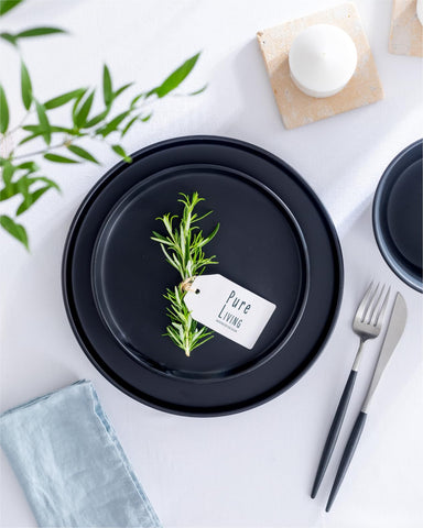 Pure Living Interior Design stack of matte black dishes saving space.