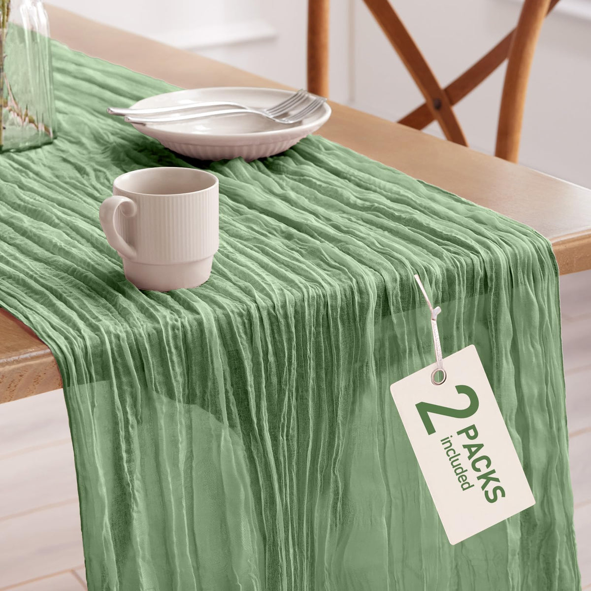 Pureegg cheesecloth table runner in sage green drapes gracefully over a standard 6- to 8-foot table.