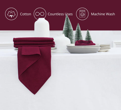 PurpleEssences solid-color burgundy napkins on a dining table