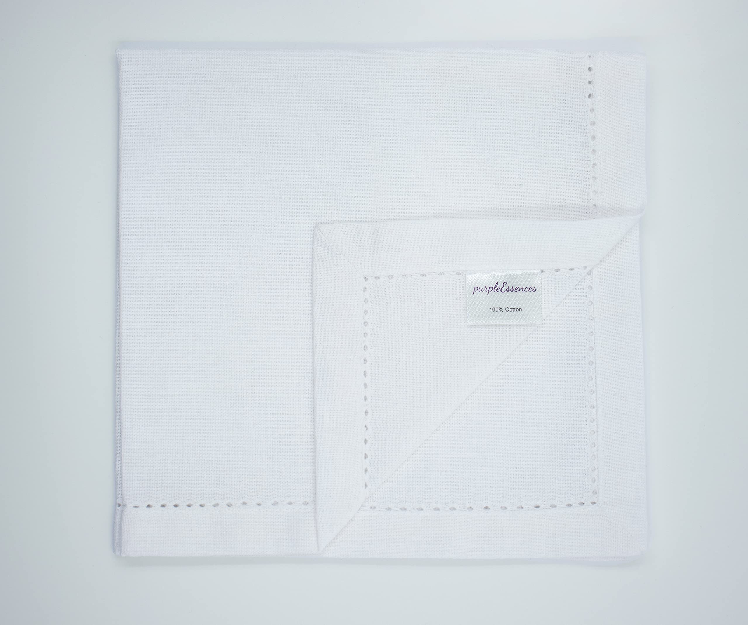 PurpleEssences white napkins on table, timeless decor for guest-ready meals.