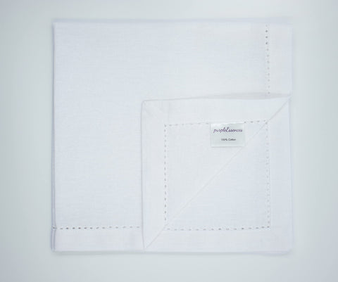 PurpleEssences white napkins on table, timeless decor for guest-ready meals.