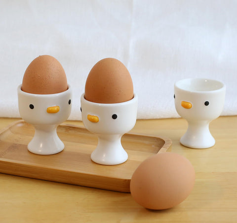 PURROOM hand-glazed yellow chick egg cup for cheerful mornings.